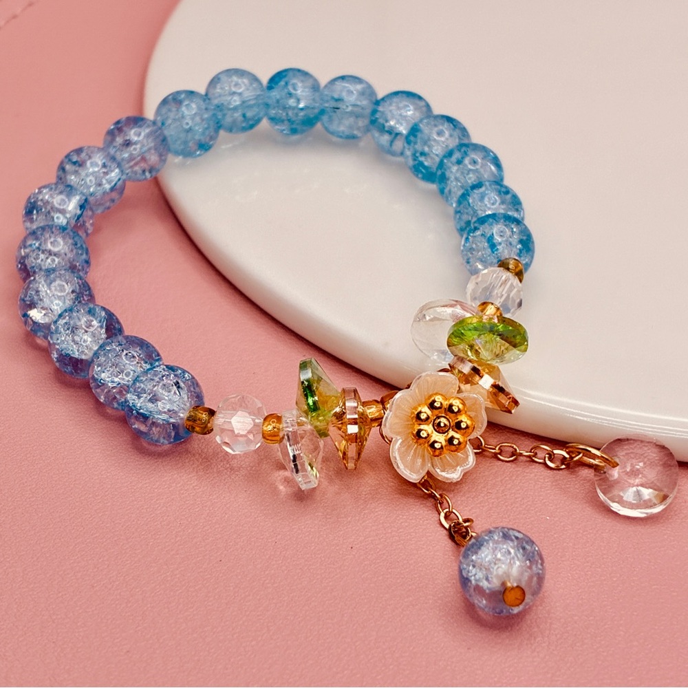 Light Blue Glass Beaded Elastic Bracelet with Floral Charms